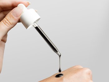 Garnier face serum on hand